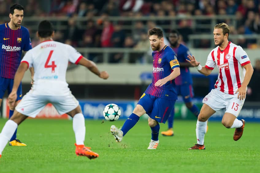 Lionel Messi playing in a soccer game for Barcelona