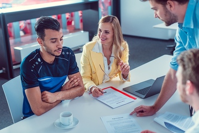 Football Player in Transfer Meeting