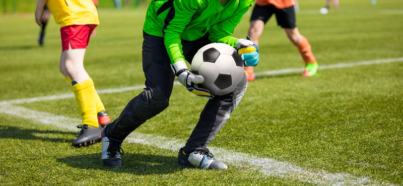 goalkeeper picking ball up