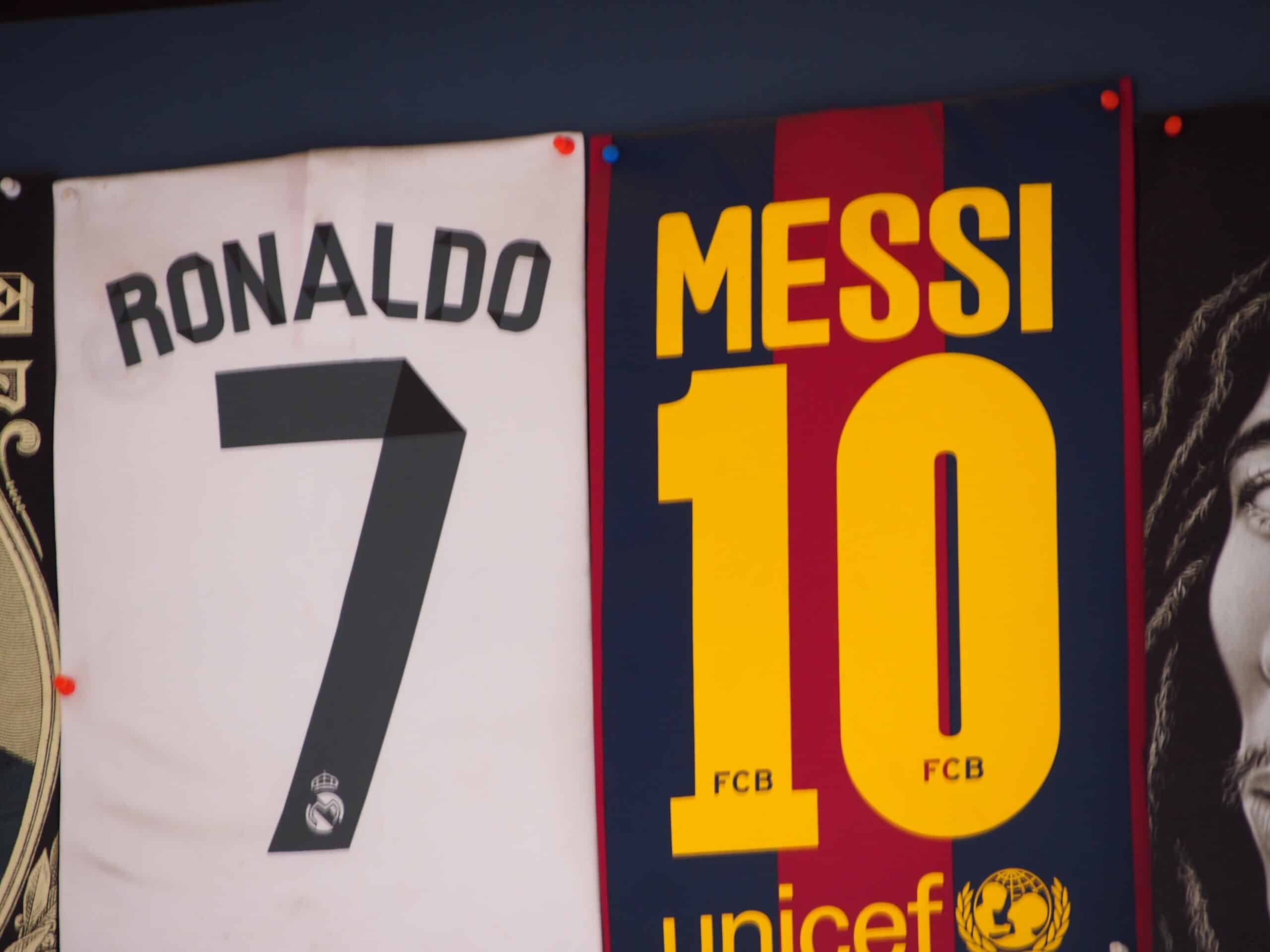 Ronaldo and Messi banners side by side.