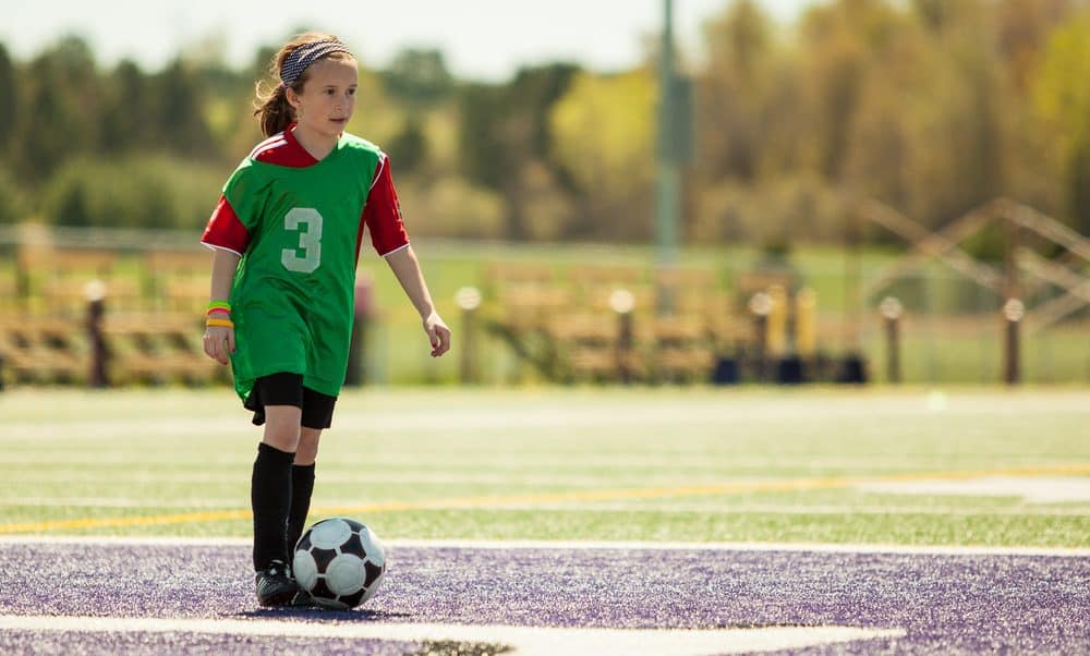 Kid playing with a Size 1 soccer ball