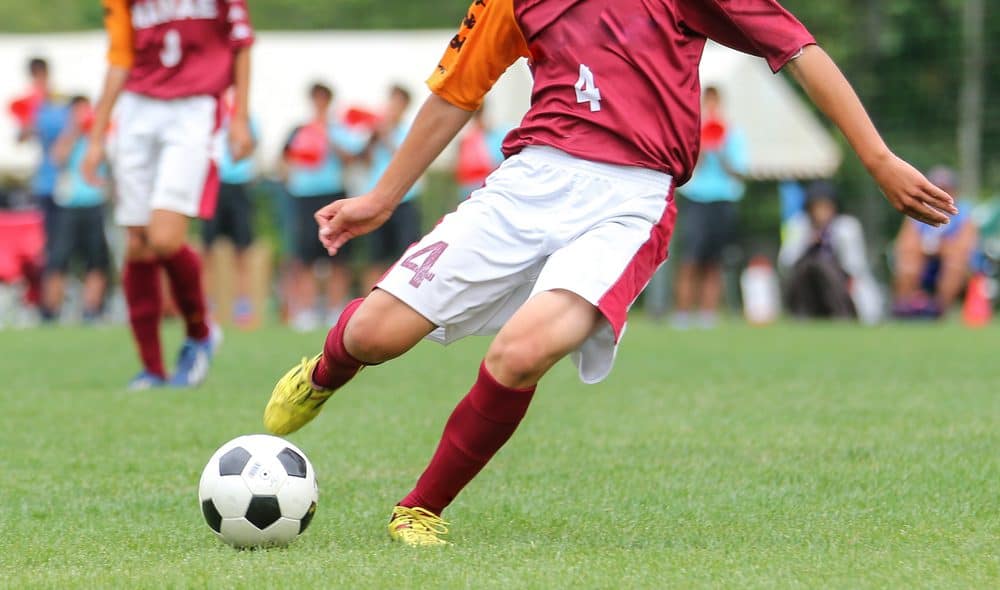 Player taking a shot with a Size 5 soccer ball