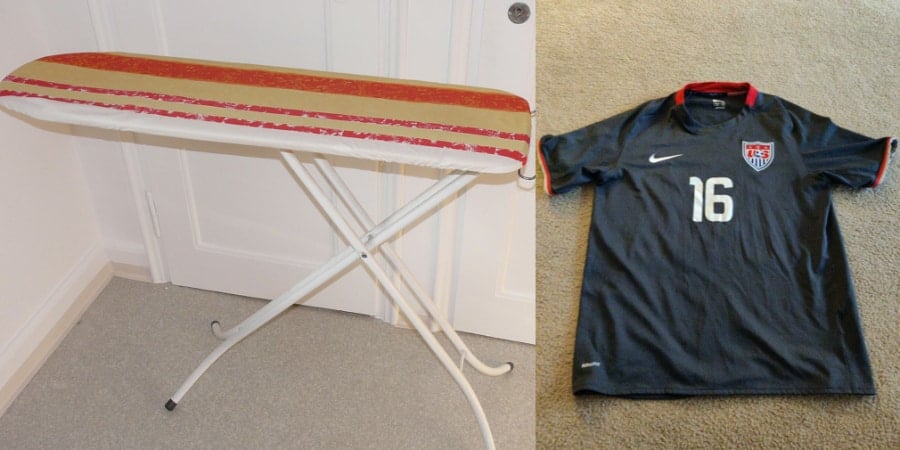 Stretching a soccer jersey on an ironing board.